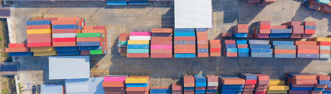 Aerial view of container cargo ship in the export and import business and logistics international goods in urban city.